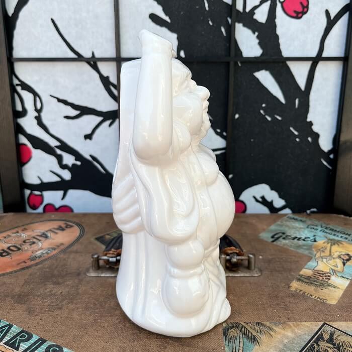 Rhino traveled back in time and found this lovely relic from Orchids of Hawaii. This White Buddha Tiki Mug was made in Taiwan and has a large opening in the back for pouring drinks and a small hole in the front for a straw! This mug is in great condition with no chips or cracks! Perfect for your home Tiki Bar or next cocktail party! He can't wait to come home with you 🍹 Shop Rhino and Lucy Tiki Mugs