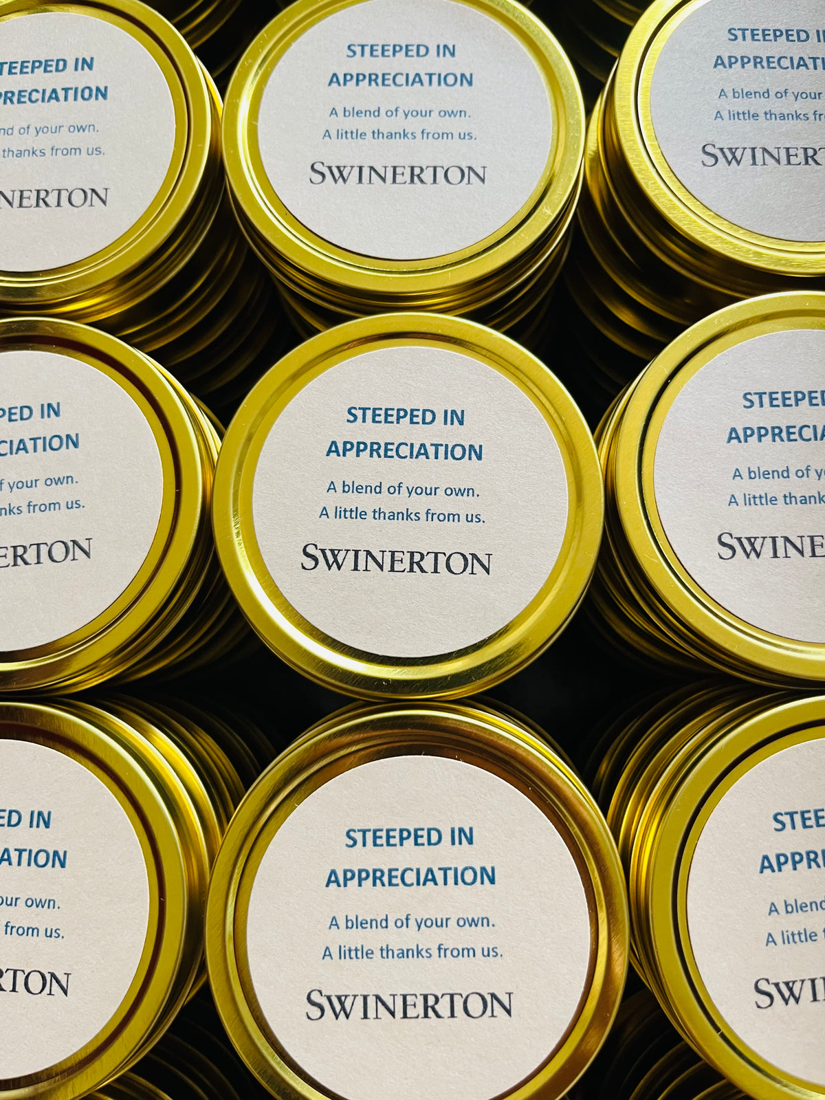 Custom branded tea tins by Rhino and Lucy used as unique corporate event favor ideas.