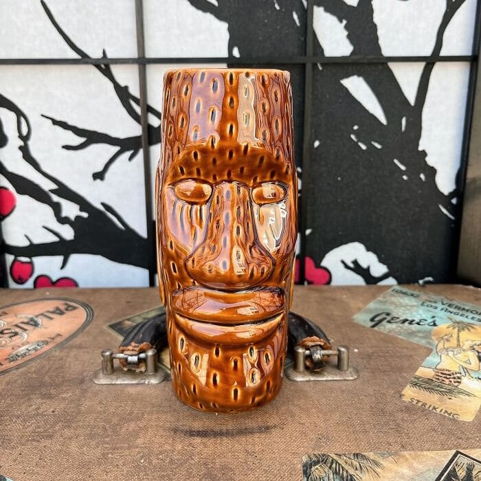 Our beloved world traveler and antique collector Rhino has found an a super fun Brown Glazed Ceramic Easter Island style Tiki mug This mug is in excellent condition with no chips or cracks! Used, in excellent condition. Holds approximately 12 ounces. Perfect for your home Tiki Bar or next cocktail party! He can't wait to come home with you! Shop Rhino and Lucy Tiki Mugs!