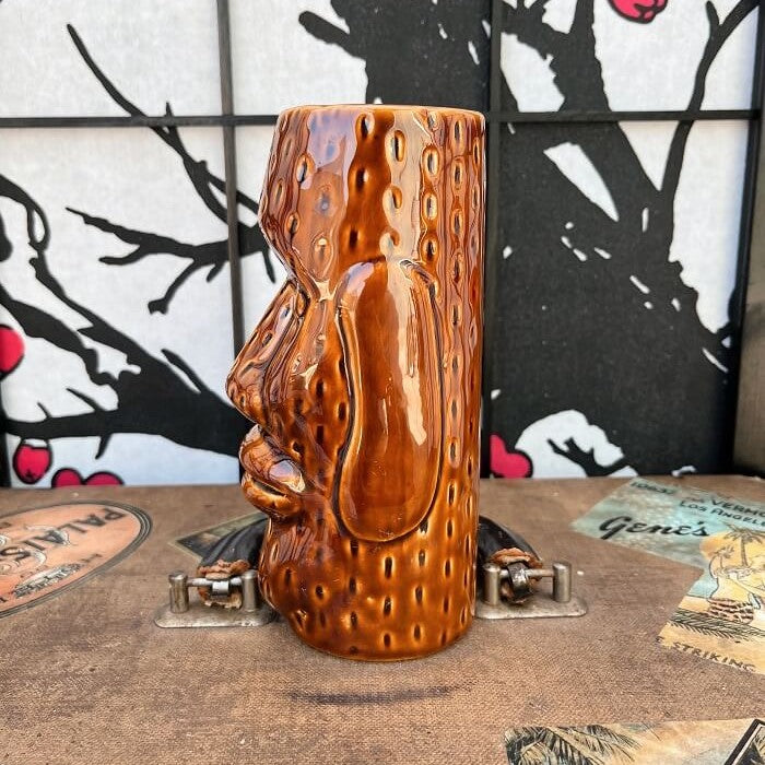 Our beloved world traveler and antique collector Rhino has found an a super fun Brown Glazed Ceramic Easter Island style Tiki mug This mug is in excellent condition with no chips or cracks! Used, in excellent condition. Holds approximately 12 ounces. Perfect for your home Tiki Bar or next cocktail party! He can't wait to come home with you! Shop Rhino and Lucy Tiki Mugs!