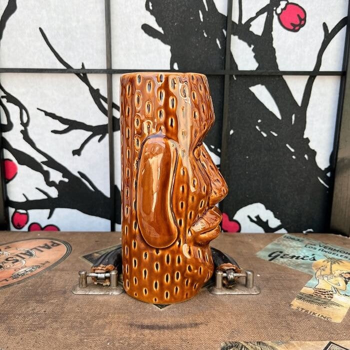 Our beloved world traveler and antique collector Rhino has found an a super fun Brown Glazed Ceramic Easter Island style Tiki mug This mug is in excellent condition with no chips or cracks! Used, in excellent condition. Holds approximately 12 ounces. Perfect for your home Tiki Bar or next cocktail party! He can't wait to come home with you! Shop Rhino and Lucy Tiki Mugs!